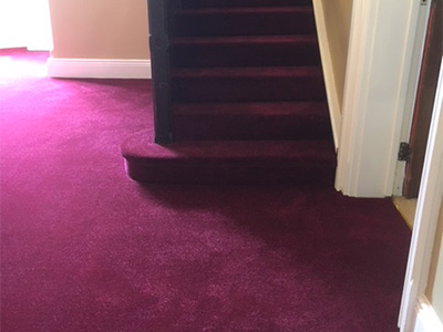 Red carpet in hallway and on stairs