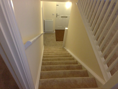 Light coloured carpet on staircase