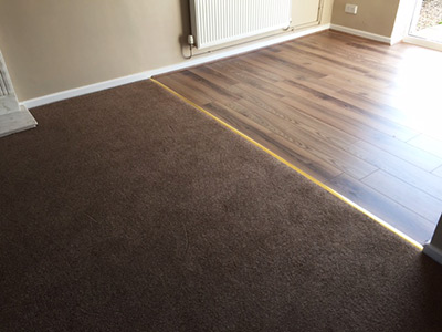 Carpet and laminate floor with join