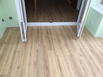 Light coloured laminate floor in conservatory