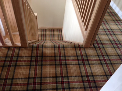 Tartan carpet on stairs and landing