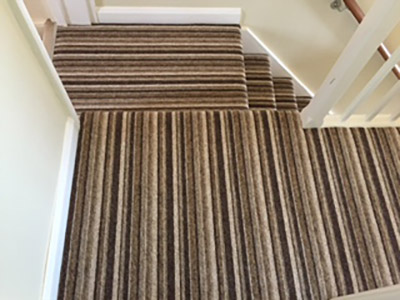 Striped carpet on stairs and landing