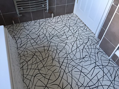 Contemporary swirl patterned vinyl flooring in bathroom