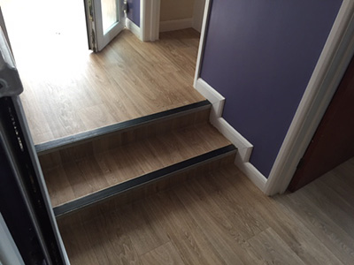 Laminate floor in hallway with steps