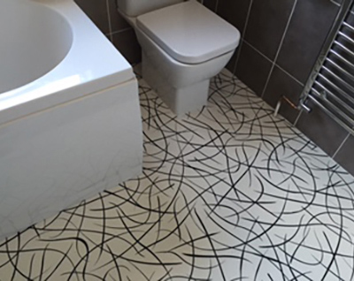 Bathroom with swirly vinyl flooring